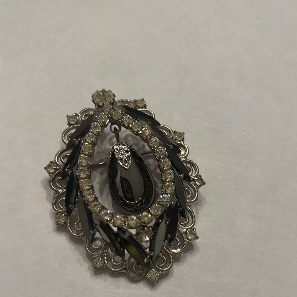 Elegant Silver and Black Brooch open center with teardrop stone